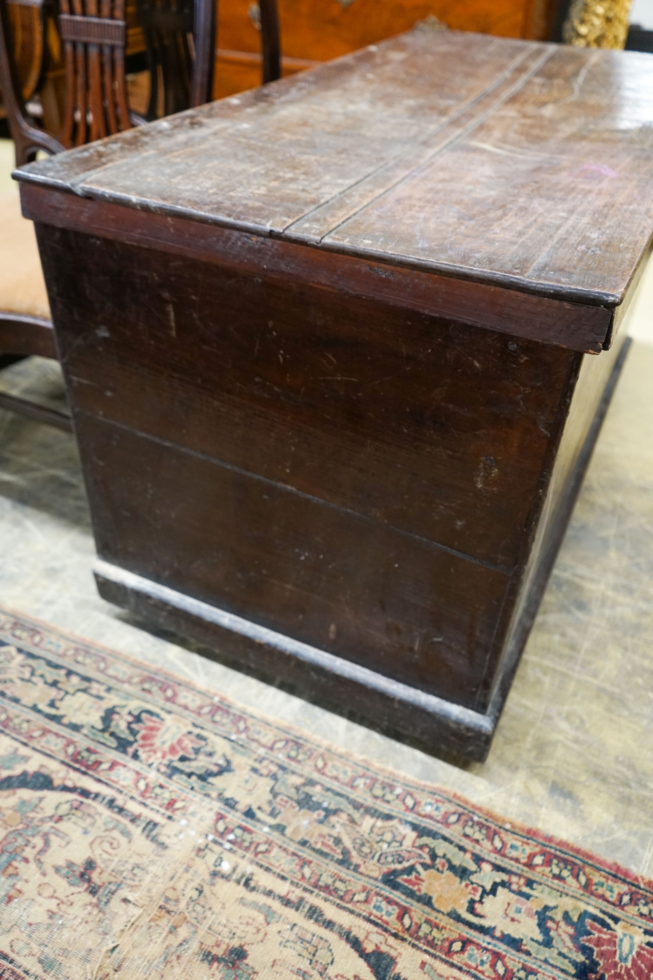 An early 19th century rectangular oak trunk, length 116cm, depth 61cm, height 66cm